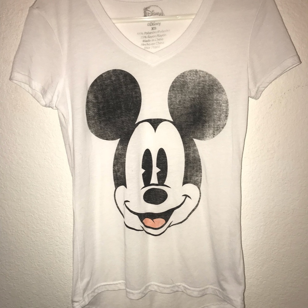 A white no sleeve Mickey Mouse shirt